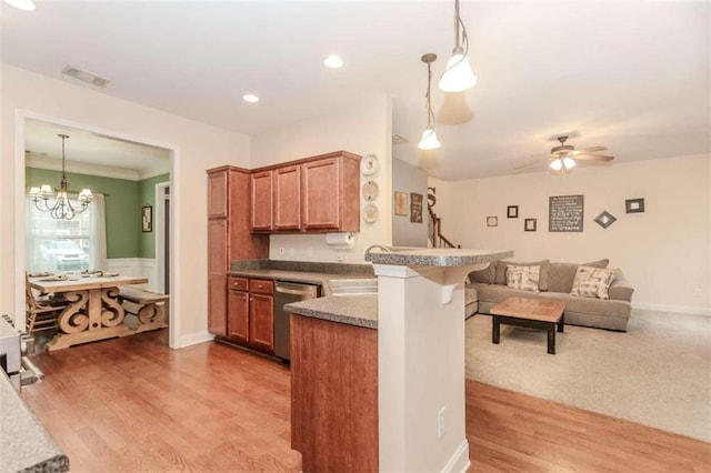 kitchen featuring stainless steel dishwasher, ceiling fan with notable chandelier, light hardwood / wood-style floors, and kitchen peninsula