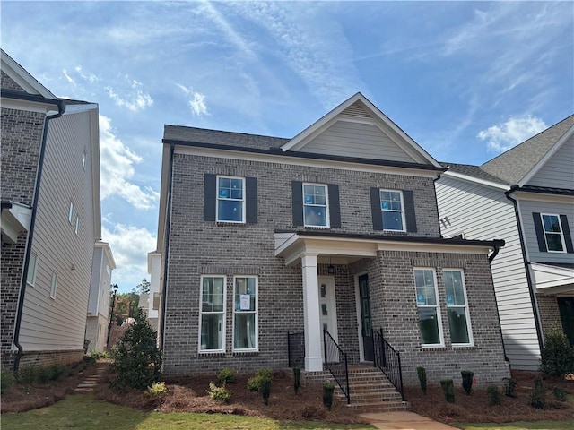 view of front facade featuring brick siding