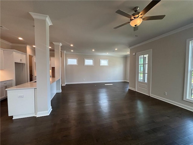 unfurnished living room with ornamental molding, dark wood finished floors, a ceiling fan, recessed lighting, and baseboards
