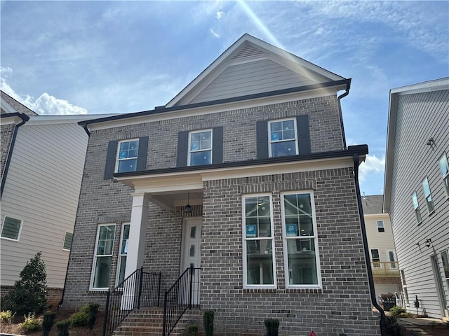 view of front of house with brick siding