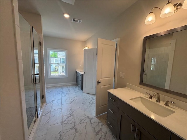 full bath featuring marble finish floors, a shower stall, two vanities, recessed lighting, and baseboards