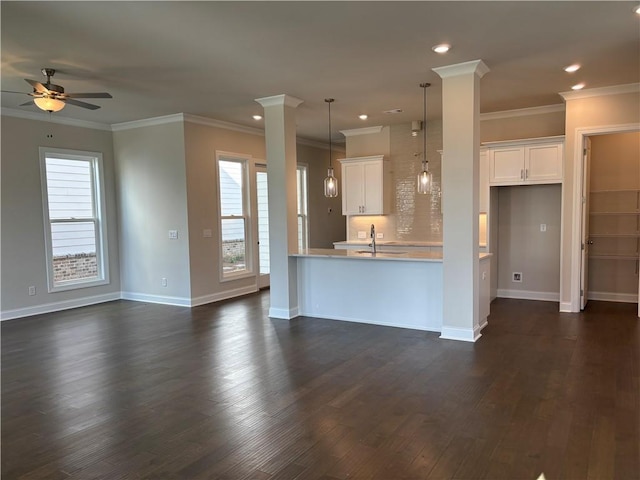 kitchen with a ceiling fan, light countertops, white cabinetry, plenty of natural light, and recessed lighting