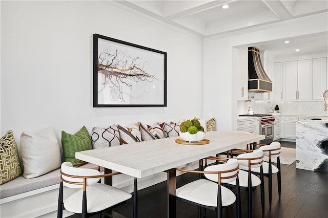 dining area featuring recessed lighting, beam ceiling, dark wood-type flooring, and coffered ceiling