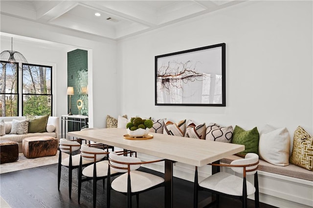 dining space with visible vents, beam ceiling, coffered ceiling, and dark wood-style flooring