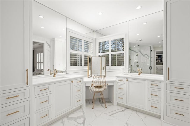 bathroom featuring recessed lighting, a marble finish shower, marble finish floor, and vanity