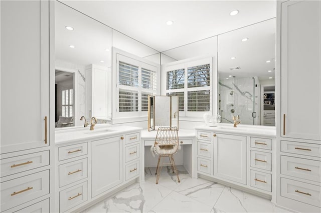 bathroom featuring a marble finish shower, healthy amount of natural light, marble look tiles, recessed lighting, and vanity