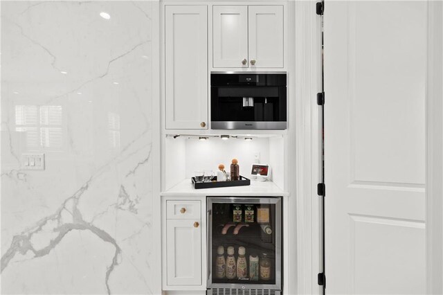 indoor dry bar featuring wine cooler