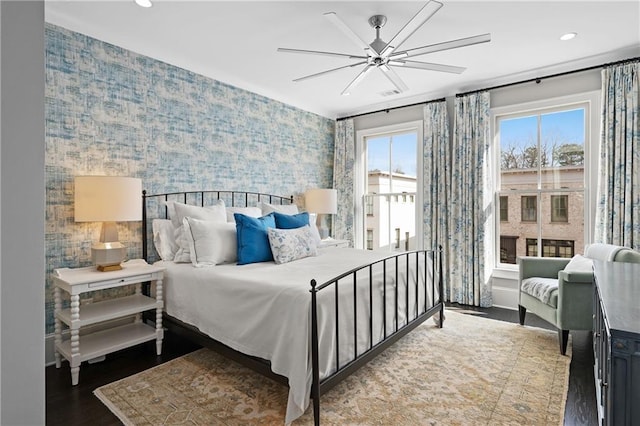 bedroom with wallpapered walls, wood finished floors, recessed lighting, and ceiling fan