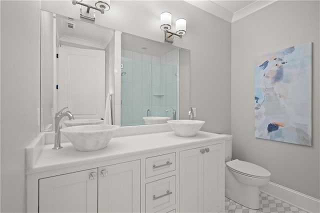 full bath with baseboards, double vanity, a stall shower, a sink, and ornamental molding