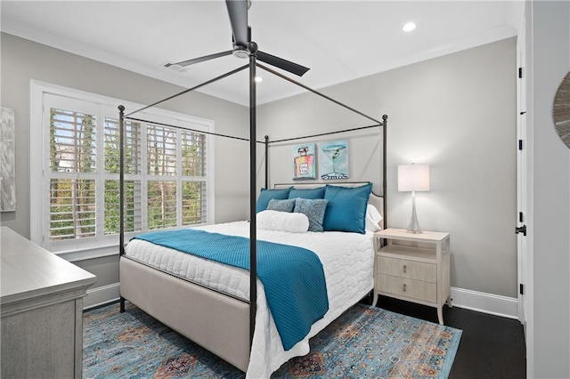 bedroom with dark wood-style floors, recessed lighting, multiple windows, and baseboards