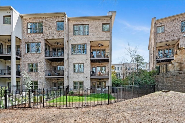 view of apartment building / complex with fence