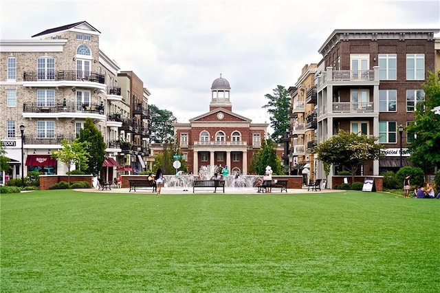 view of home's community with a lawn