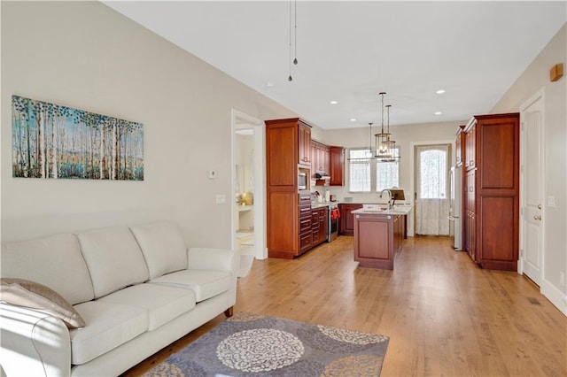 living room featuring light wood-style floors and recessed lighting