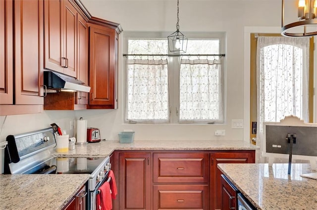 kitchen with under cabinet range hood, decorative light fixtures, electric range, and light stone countertops