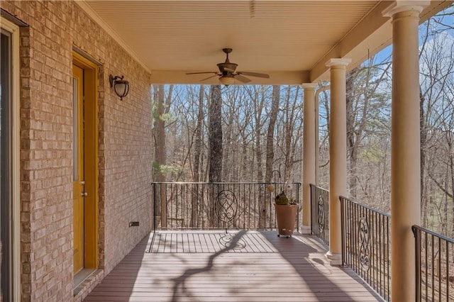 wooden deck featuring a ceiling fan