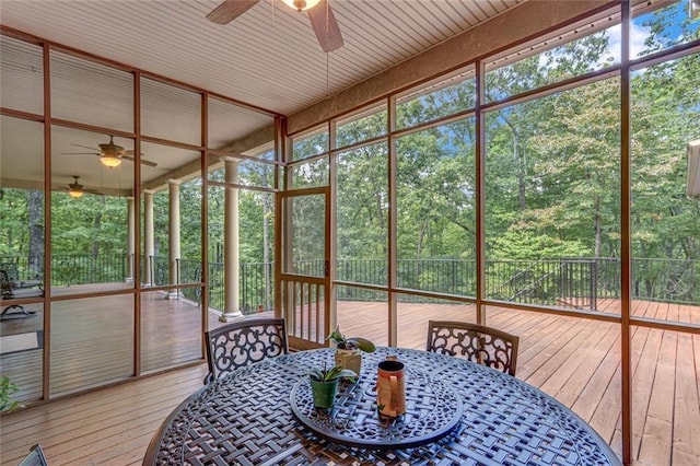 sunroom / solarium with a ceiling fan