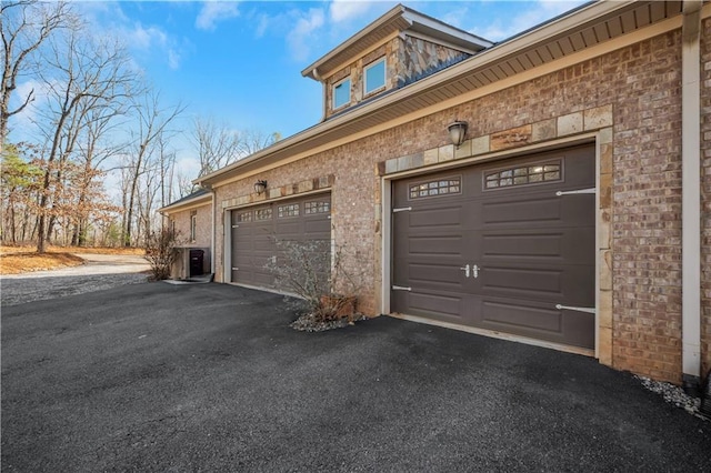 garage with aphalt driveway