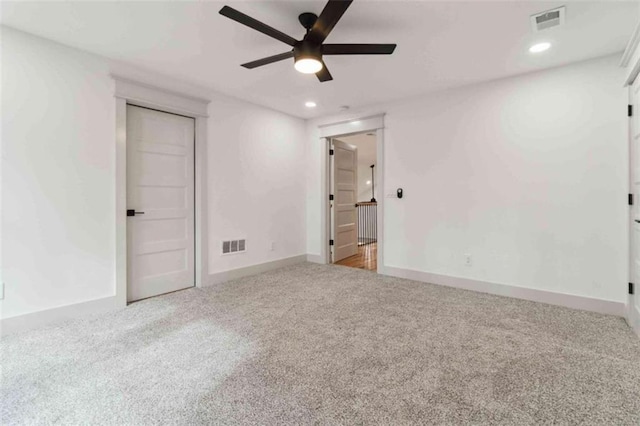 unfurnished bedroom with carpet, visible vents, baseboards, and recessed lighting