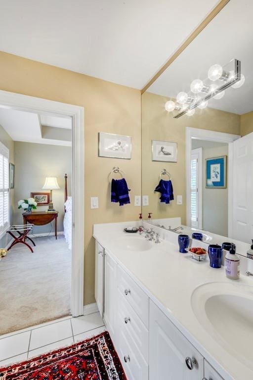 bathroom featuring tile patterned flooring and vanity