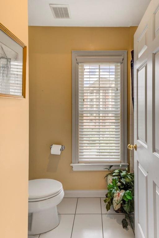 bathroom featuring tile patterned flooring and toilet