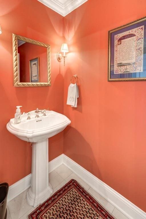 bathroom with tile patterned floors and crown molding