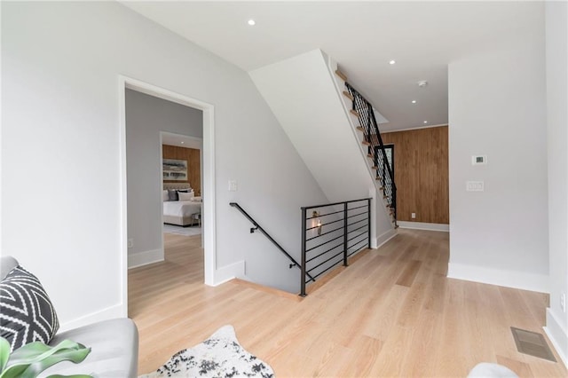 stairs featuring visible vents, recessed lighting, baseboards, and wood finished floors