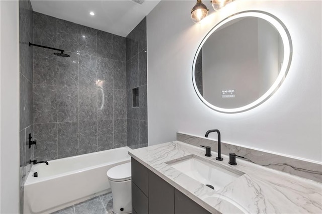 bathroom with vanity, toilet, and tub / shower combination