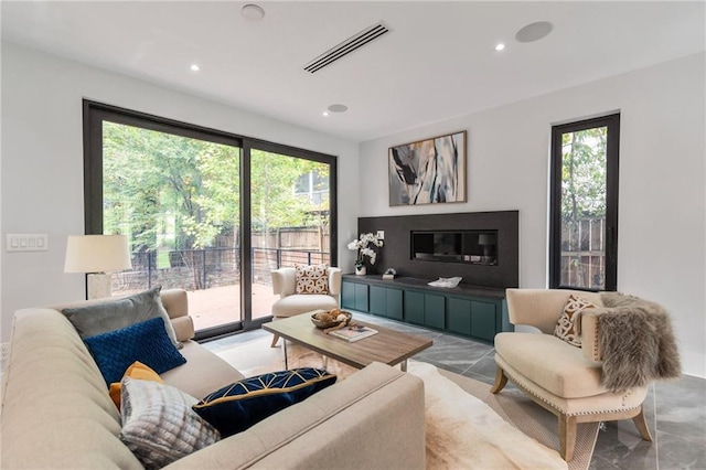 living area with recessed lighting and visible vents