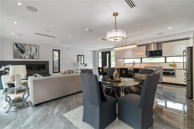 dining space with recessed lighting, visible vents, and marble finish floor