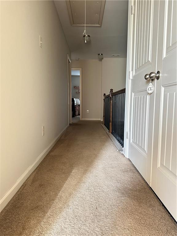 302 Turtle Creek Dr, Winder, GA 30680 - corridor featuring attic access, carpet floors, and baseboards