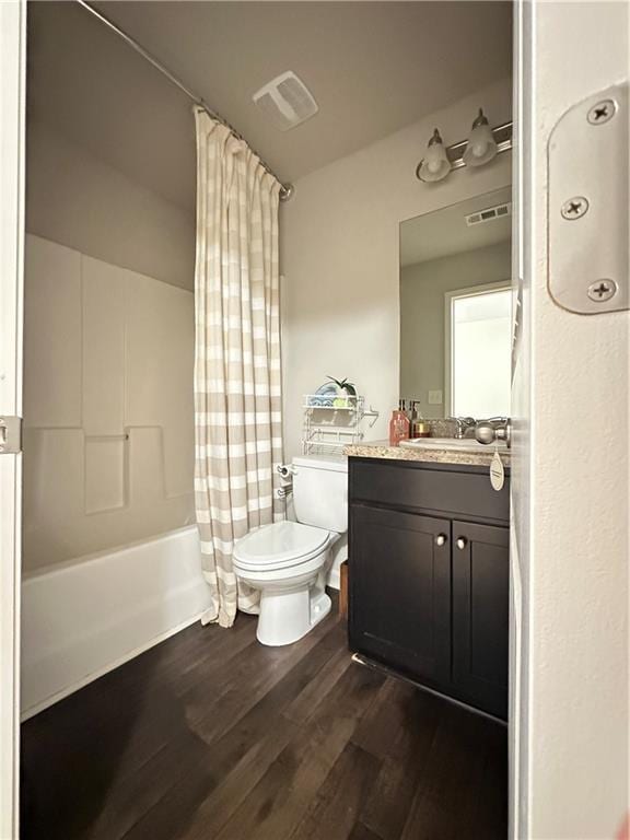302 Turtle Creek Dr, Winder, GA 30680 - bathroom with toilet, wood finished floors, vanity, and shower / bathtub combination with curtain