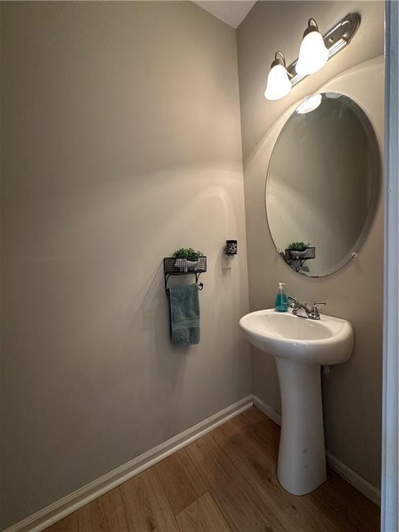 302 Turtle Creek Dr, Winder, GA 30680 - bathroom featuring wood finished floors and baseboards