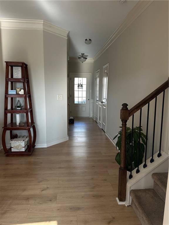 302 Turtle Creek Dr, Winder, GA 30680 - entrance foyer featuring crown molding, stairs, light wood-type flooring, and baseboards