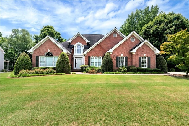 3885 Lake Juliette Dr, Buford, GA 30519 - traditional-style house with brick siding and a front lawn