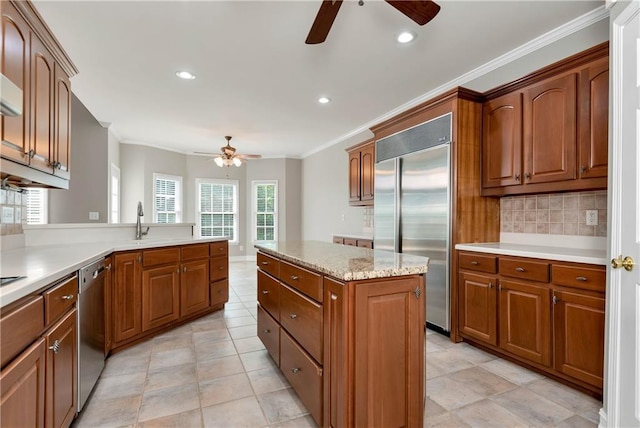3885 Lake Juliette Dr, Buford, GA 30519 - kitchen featuring ceiling fan, stainless steel appliances, ornamental molding, brown cabinets, and backsplash