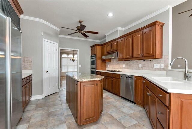 3885 Lake Juliette Dr, Buford, GA 30519 - kitchen featuring stainless steel appliances, ceiling fan, a sink, under cabinet range hood, and ornamental molding
