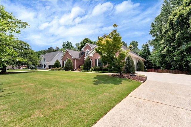 3885 Lake Juliette Dr, Buford, GA 30519 - view of front facade with driveway, a front lawn, and brick siding