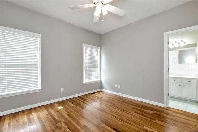 3885 Lake Juliette Dr, Buford, GA 30519 - unfurnished room featuring baseboards, light wood-style flooring, and ceiling fan