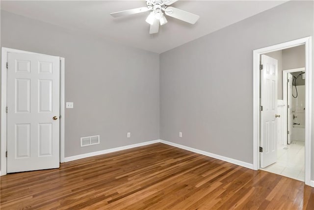 3885 Lake Juliette Dr, Buford, GA 30519 - spare room with a ceiling fan, wood finished floors, and baseboards