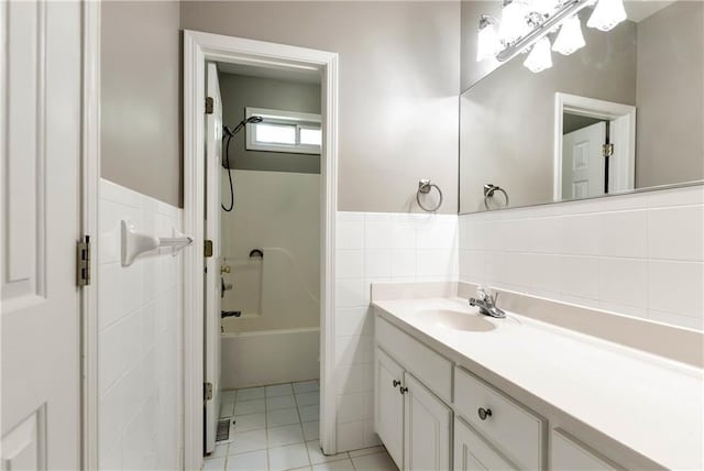 3885 Lake Juliette Dr, Buford, GA 30519 - bathroom with tile walls, vanity, wainscoting, shower / tub combination, and tile patterned floors