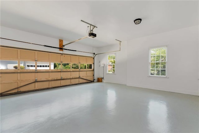 3885 Lake Juliette Dr, Buford, GA 30519 - garage with a garage door opener and baseboards