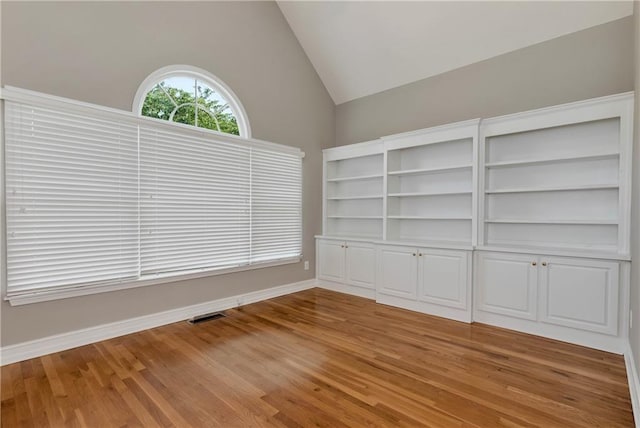 3885 Lake Juliette Dr, Buford, GA 30519 - empty room featuring lofted ceiling, light wood finished floors, and baseboards