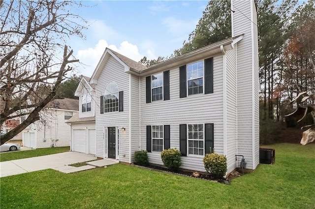 view of front facade with a garage and a front lawn