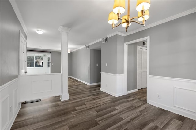 80 Montre Sq NW, Atlanta, GA 30327 - unfurnished dining area featuring a chandelier, wainscoting, dark wood-style flooring, crown molding, and a decorative wall
