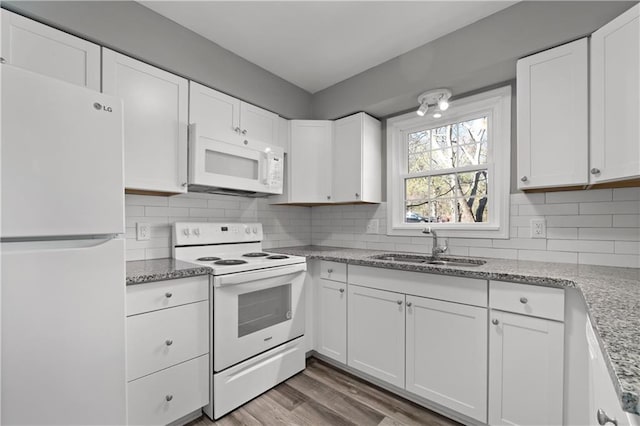 80 Montre Sq NW, Atlanta, GA 30327 - kitchen featuring white appliances, a sink, white cabinets, and decorative backsplash