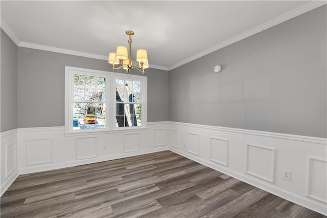 80 Montre Sq NW, Atlanta, GA 30327 - unfurnished dining area featuring a chandelier, a wainscoted wall, dark wood-style flooring, crown molding, and a decorative wall