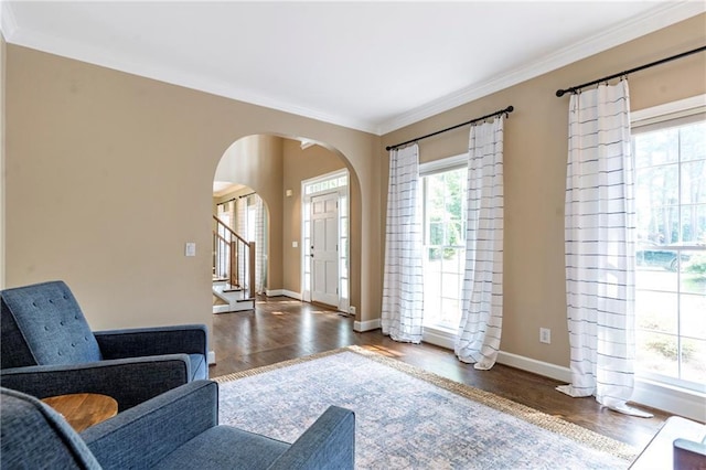 5396 Turnbill Pt NW, Acworth, GA 30101 - entrance foyer featuring arched walkways, ornamental molding, and wood finished floors