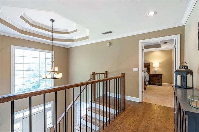 5396 Turnbill Pt NW, Acworth, GA 30101 - hall with a chandelier, an upstairs landing, crown molding, and wood finished floors
