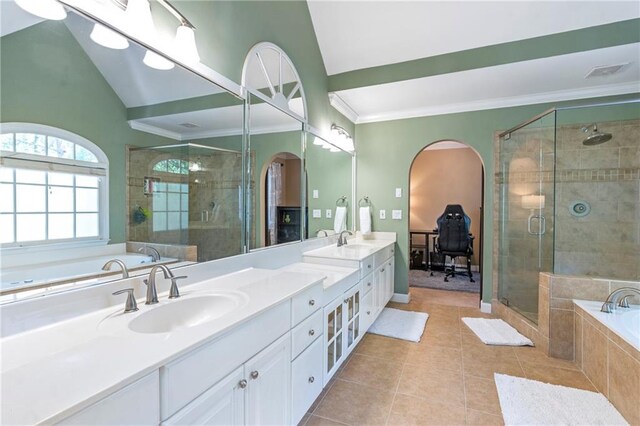 5396 Turnbill Pt NW, Acworth, GA 30101 - bathroom featuring double vanity, a bath, a shower stall, tile patterned flooring, and crown molding