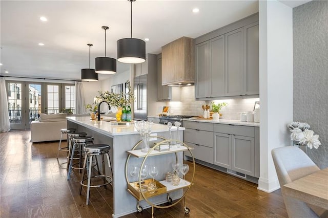 726 Edgewood Ave NE, Atlanta, GA 30307 - kitchen with gray cabinetry, a sink, wall chimney range hood, and light countertops